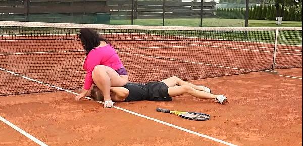  Obese woman facesits on her trainer at the tennis court